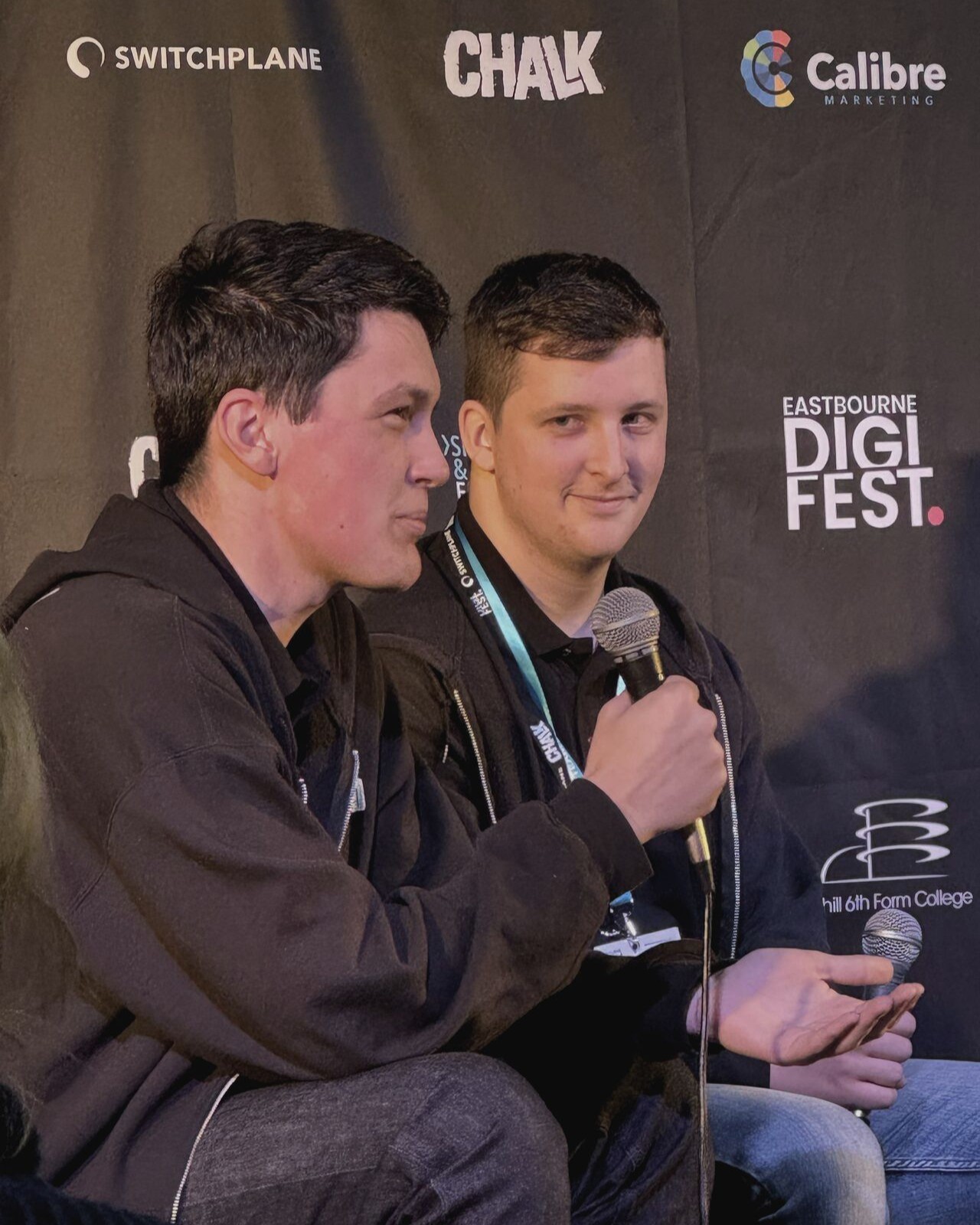 Tyler Mortimer-Wise and Ben McCormick having a conversation at the conference.